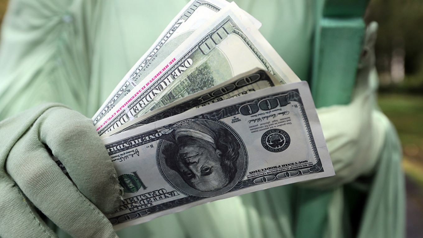 Putin S Dollar Dump Costs Russia 8bln The Moscow Times Putin S Dollar Dump Costs Russia 8bln