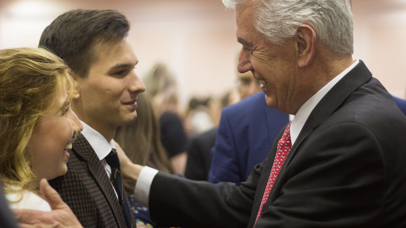 
					Elder Dieter F. Uchtdorf of the Quorum of the Twelve Apostles of the Church speaks to a newlywed couple after a church conference in St. Petersburg					 					The Twelve Apostles of the Church Press Service				