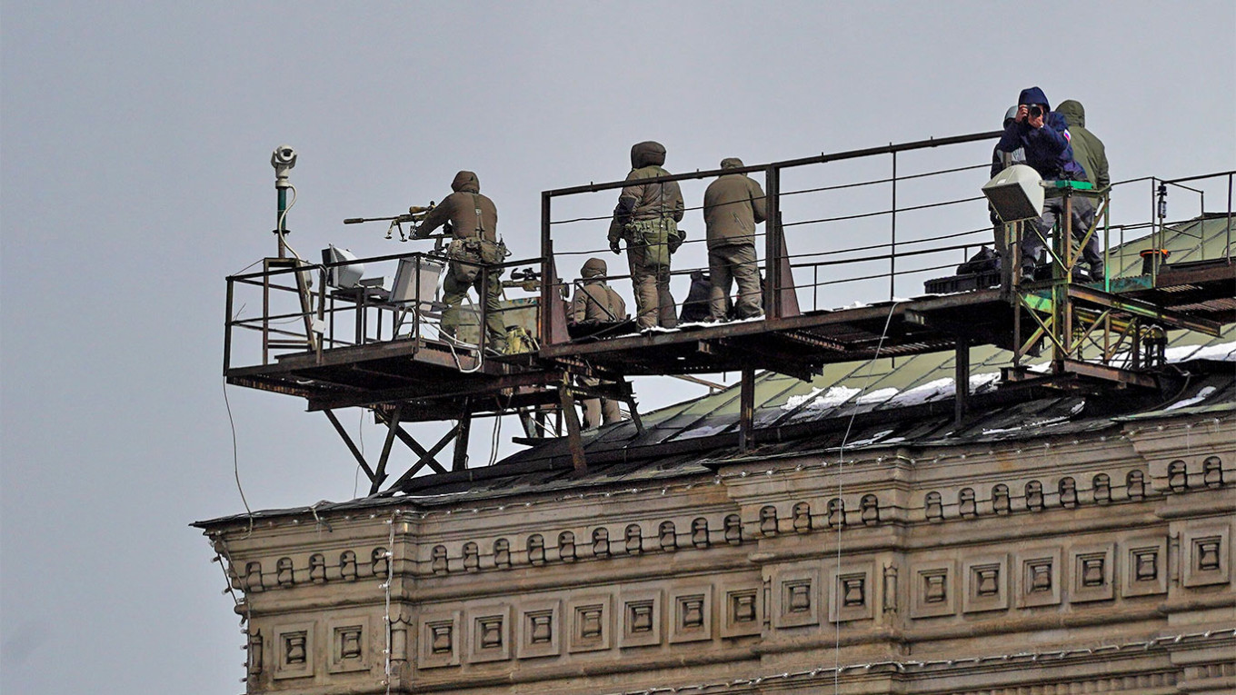 
					Snipers on the roof of the GUM department store during the military parade on Red Square.					 					Alexander Avilov / Moskva News Agency				
