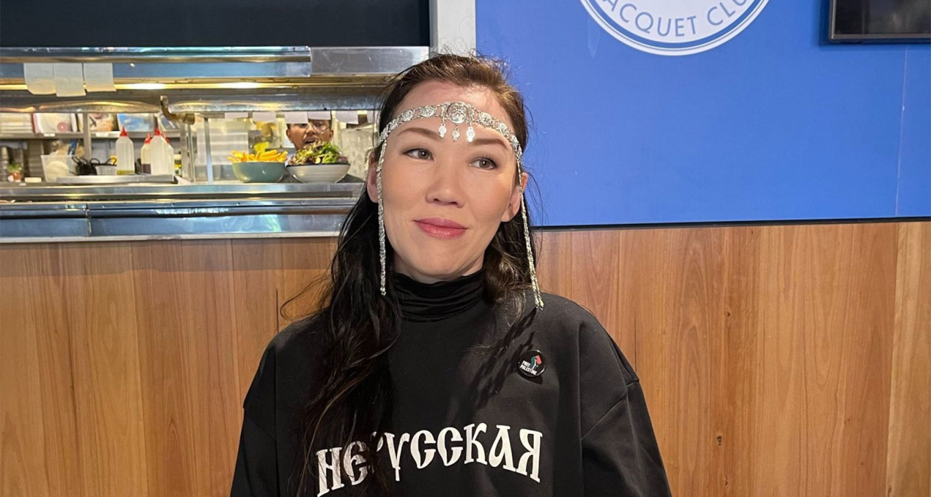 
					Kondakova poses in a T-shirt by 4 Oirad, an indigenous brand from the republic of Kalmykia, that reads "I'm not Russian."					 					Courtesy photo				