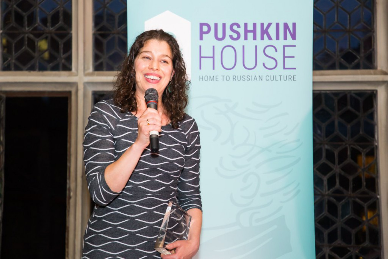 
					Alexis Peri receives her award.					 					Courtesy of Pushkin House				