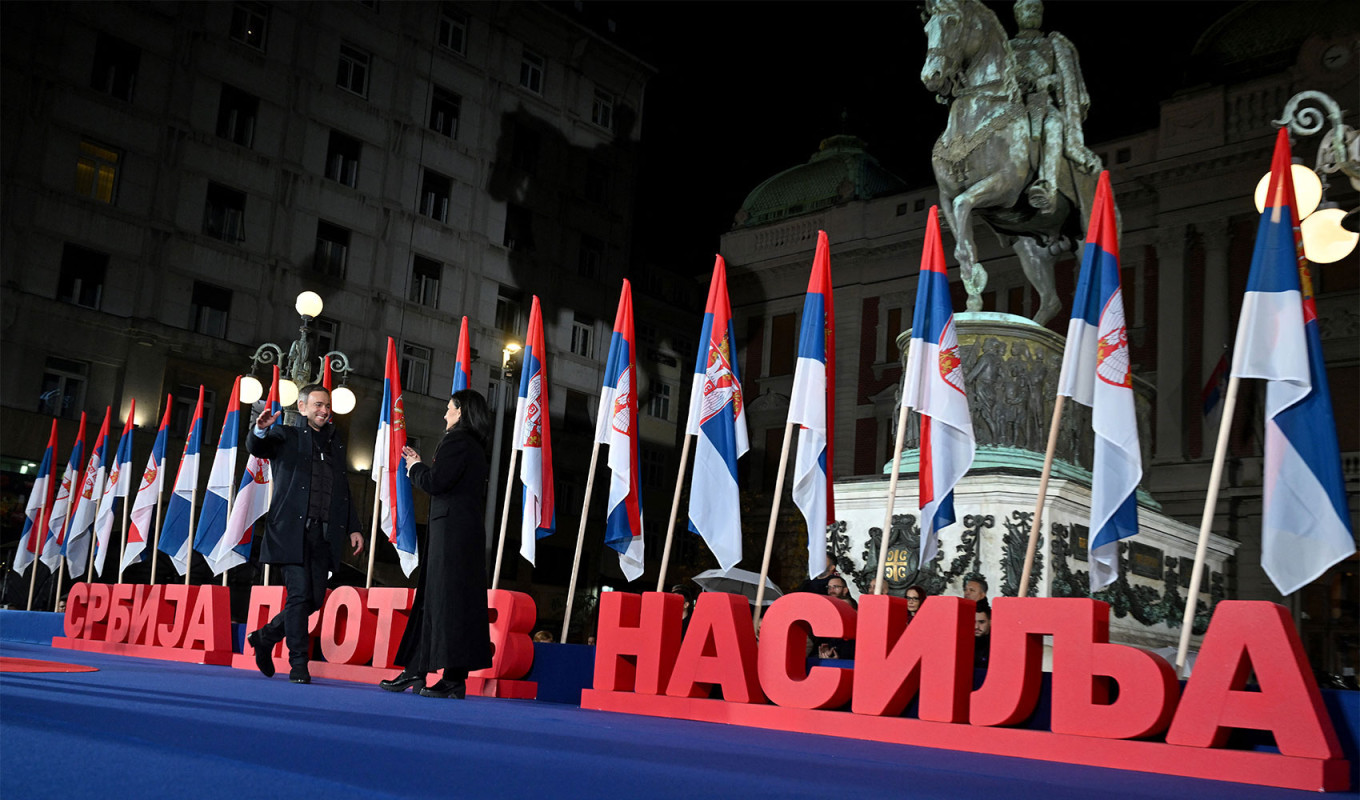 
					The leader of the People's Movement of Serbia Miroslav Aleksic (L) greets Party of Freedom and Justice's Marinika Tepic (R) during the final pre-election rally of the Serbia Against Violence opposition coalition in Belgrade.					 					Andrej Isakovic / AFP				