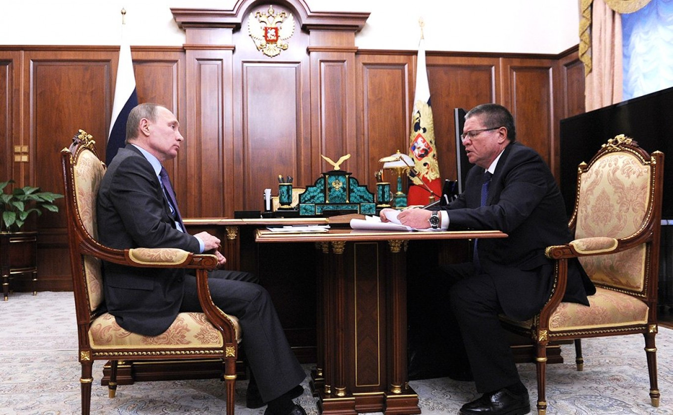 
					Vladimir Putin meets with Alexei Ulyukayev in January 2016.					 					Kremlin Press Service				