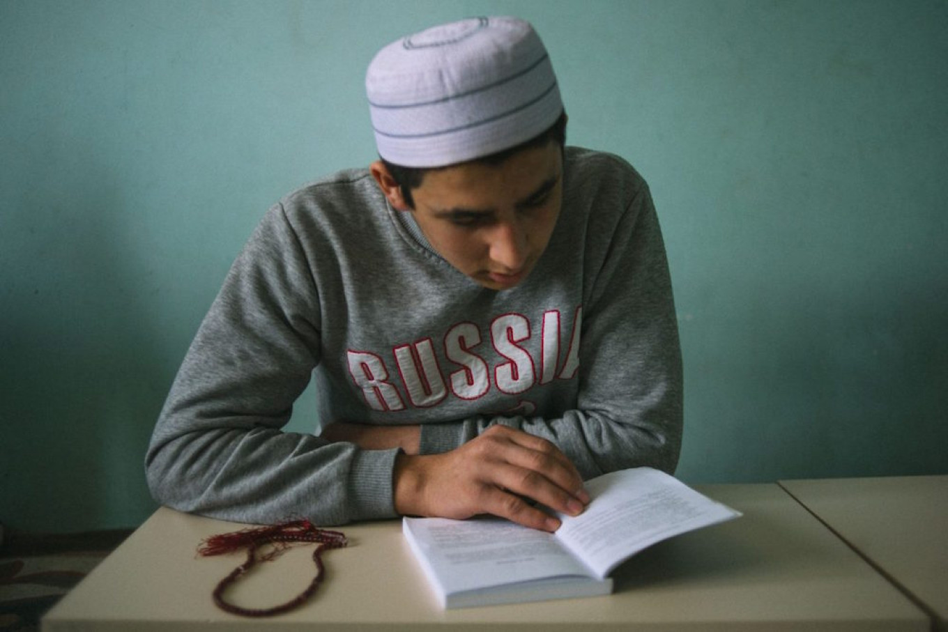 
					A student at the Volga Islamic Center reads from the Qoran					 					Sergey Karpov for TD				