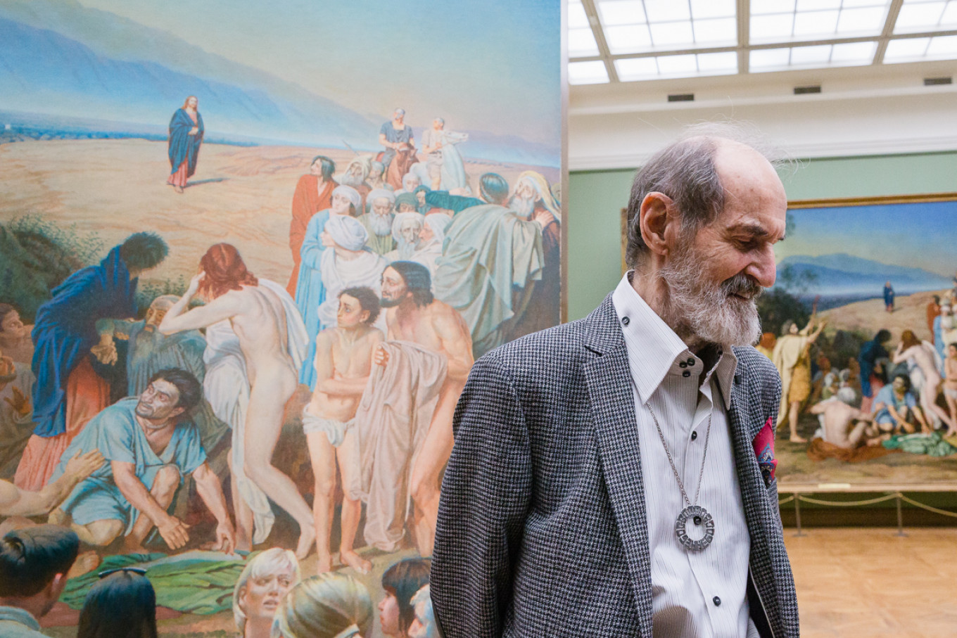 
					The artist Erik Bulatov with his painting against the background of Ivanov's.					 					Anastasia Zamyatina / Tretyakov Gallery				