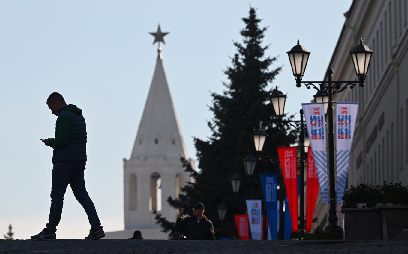 
					A man with a phone during the BRICS summit in Kazan.					 					Stanislav Krasilnikov / brics-russia2024.ru				