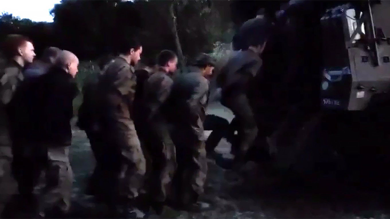 
					Russian conscripts surrender to the Ukrainian armed forces in the Kursk region.					 					Video grab				