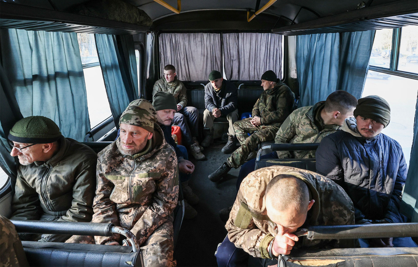 
					Ukrainian prisoners of war on a bus in occupied Melitopol.					 					Alexander Polegenko / TASS				