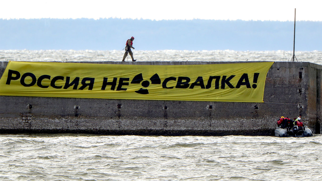 
					Greenpeace activists unfurl a banner with a message reading "Russia is not a [radioactive waste] dumping ground!" in the port of Ust-Luga on Russia's coast of the Gulf of Finland in 2020.					 					Peter Kovalev / TASS				
