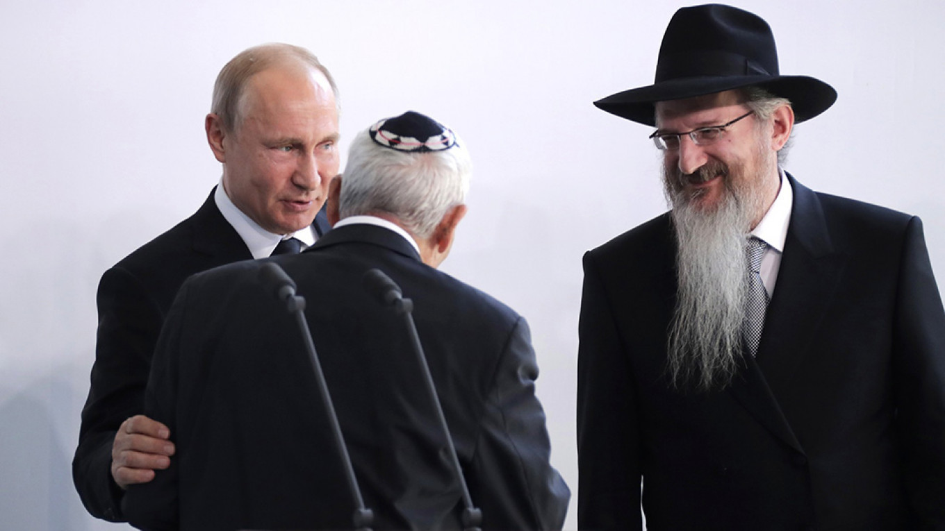 
				Putin, with Russia’s chief rabbi Berel Lazar, right, has fashioned himself as a backer of Russia’s Jewish community				 				Mikhail Metsel / TASS			