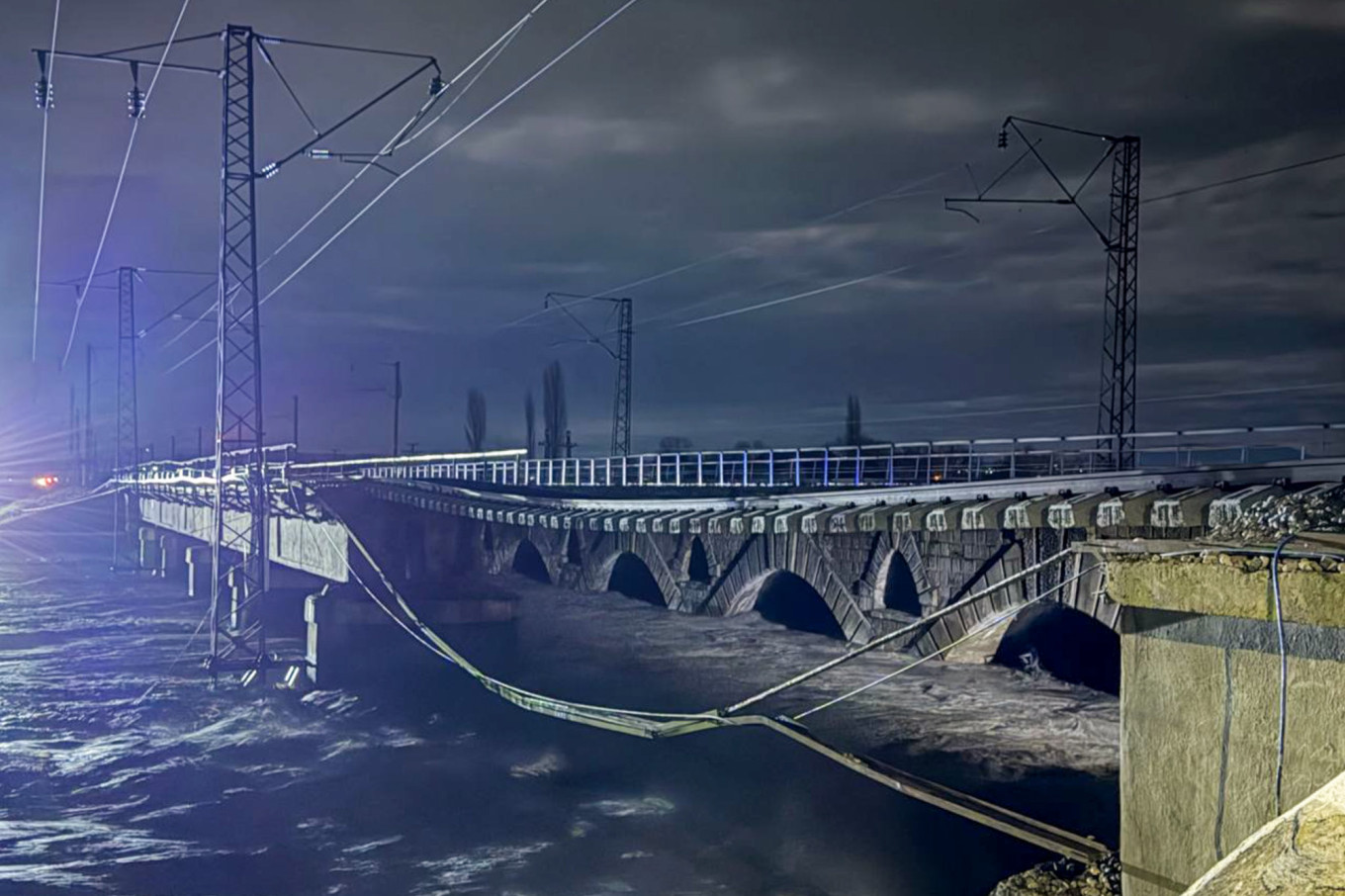 
					A view of a railway bridge in the outskirts of the village of Dzhemikent, republic of Dagestan. The bridge's pillar collapsed due to a mudslide.					 					Gyanzhevi Gadzhibalayev / TASS				