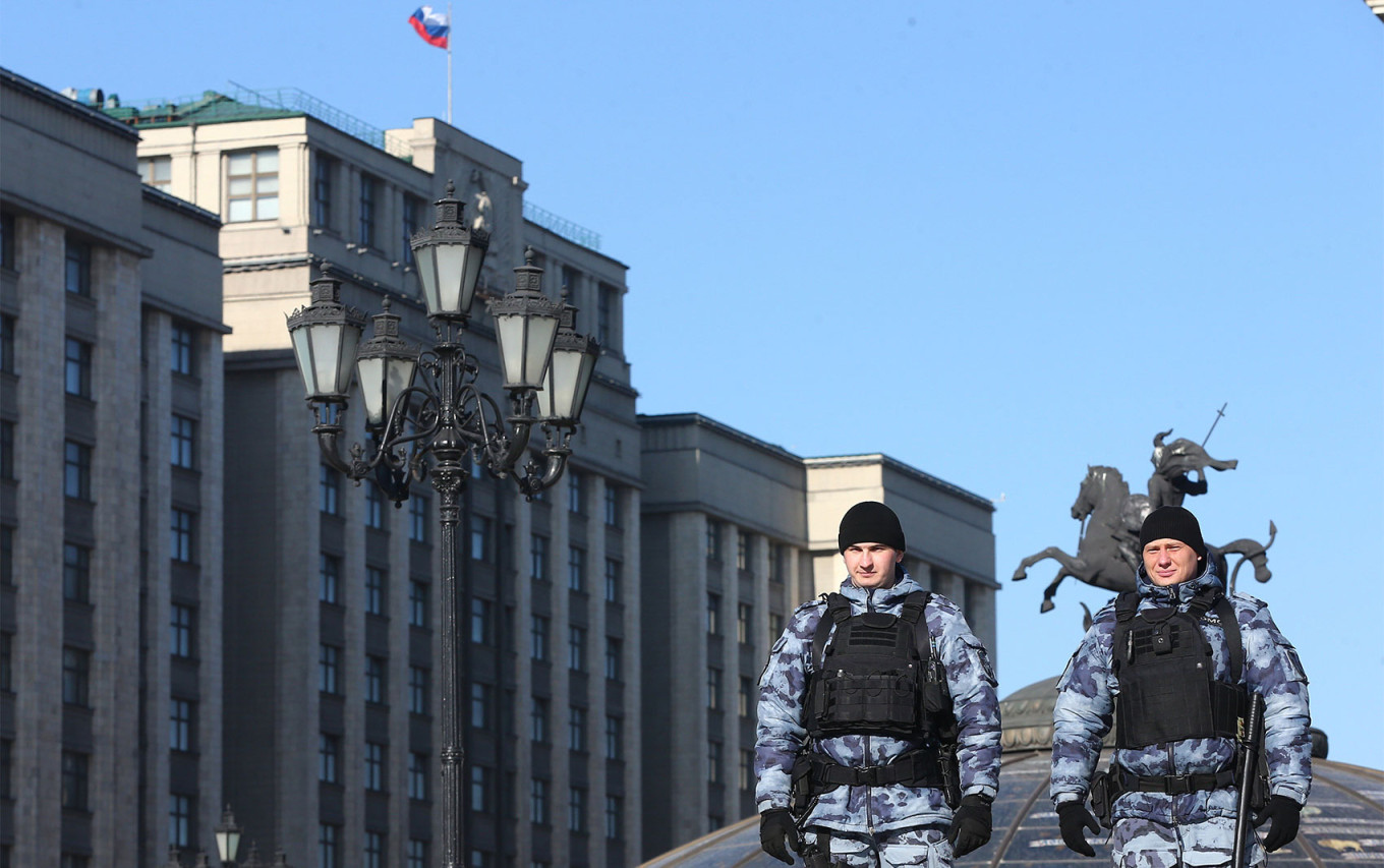 
					Riot police officers near the State Duma in Moscow.					 					Sergei Vedyashkin / Moskva News Agency				