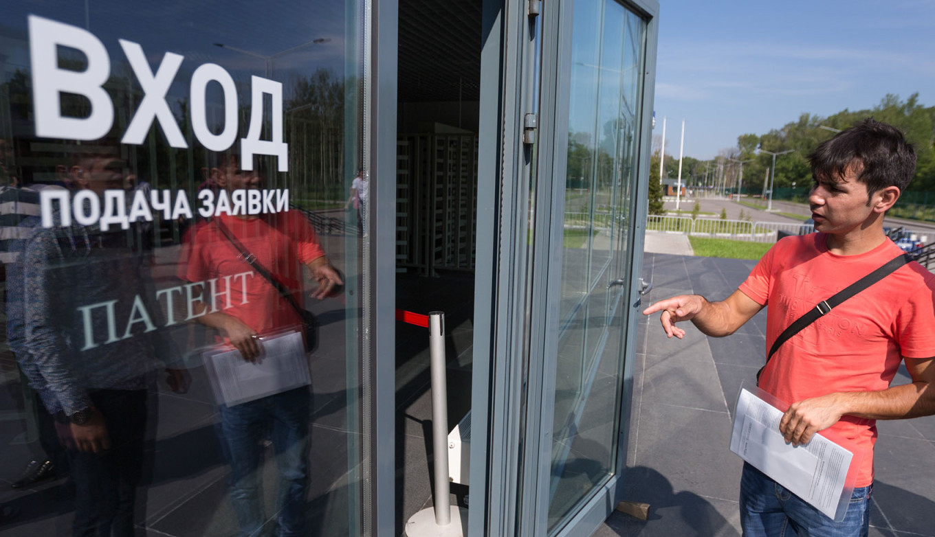 
					A migrant worker in front of the Sakharov Migration Center in Moscow.					 					Kirill Zykov / Moskva News Agency				