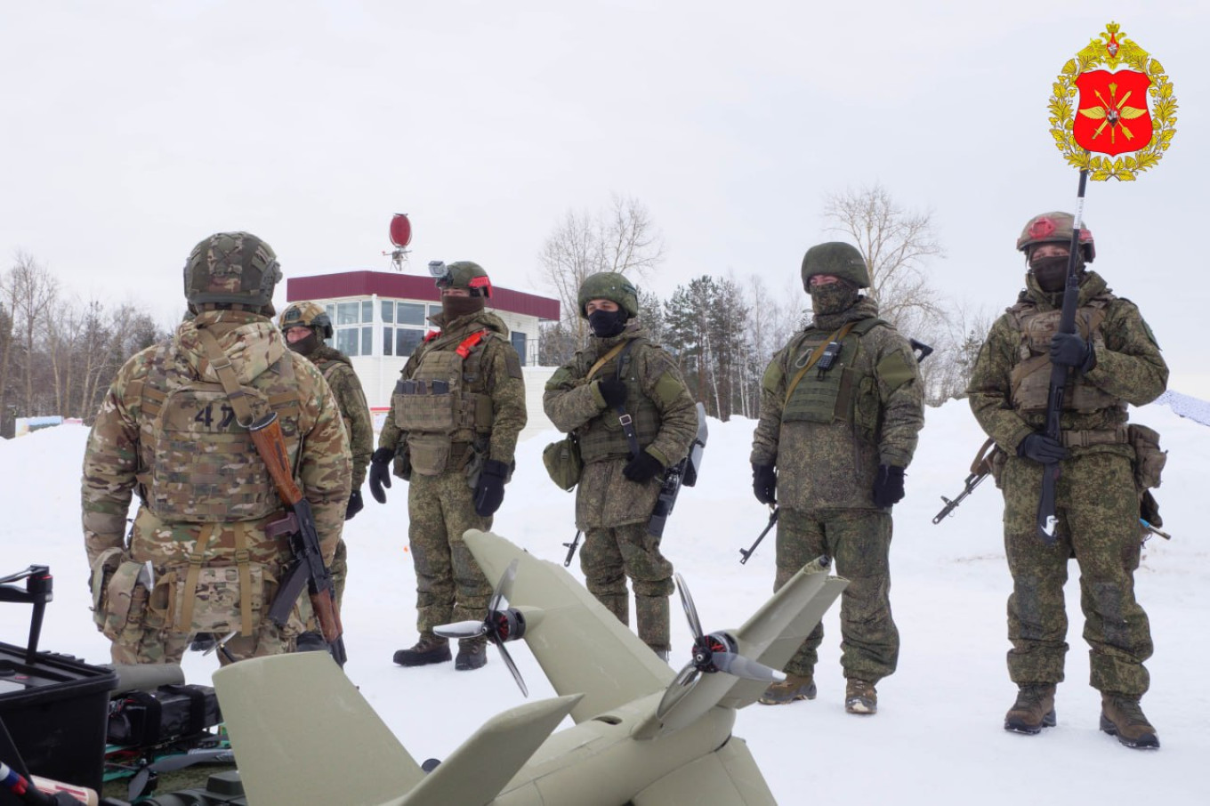 
					Russian contract soldiers from motor rifle units take part in drone training exercises at a Moscow Military District range					 									