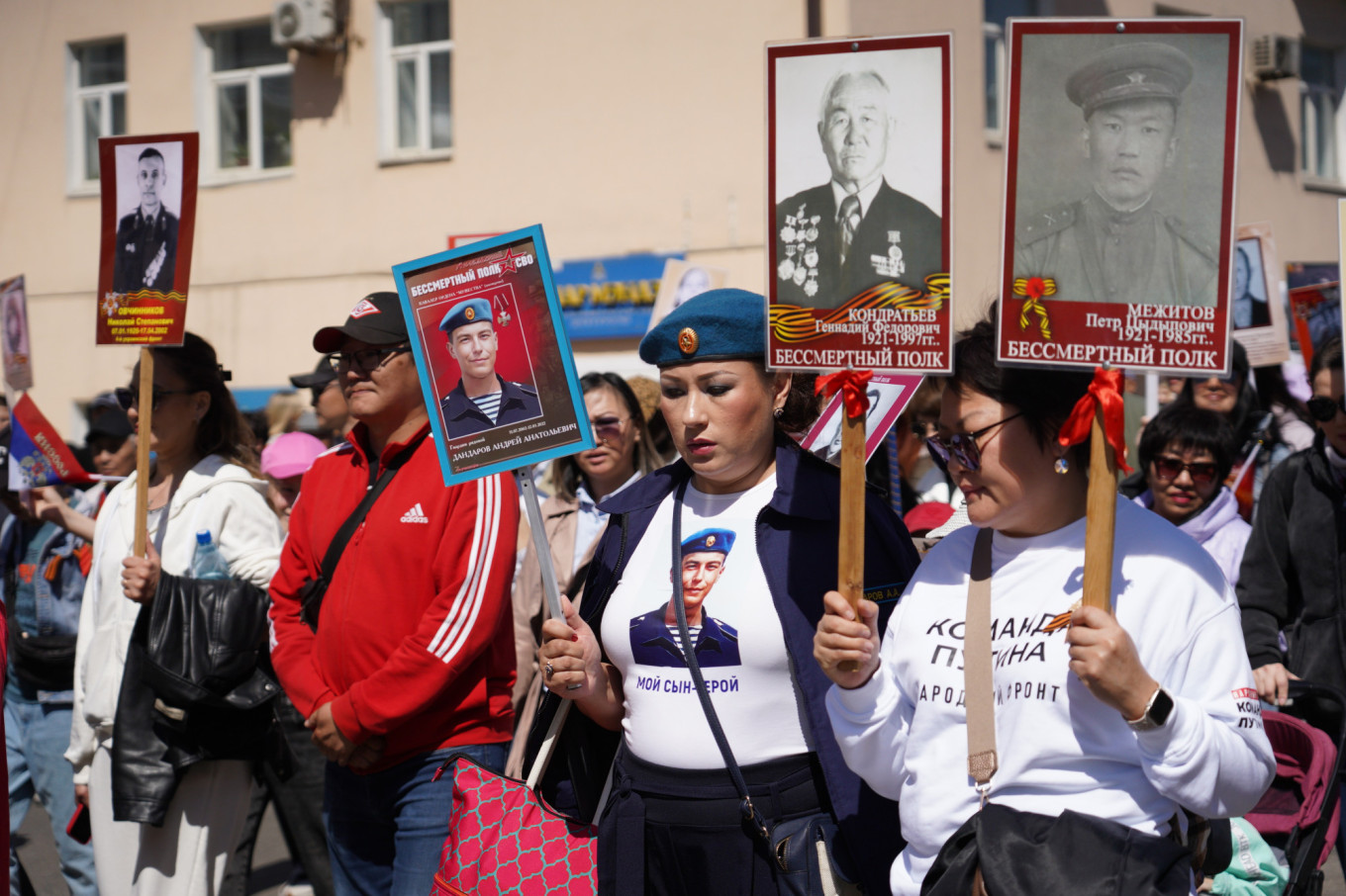 Women carry portraits of family members who died in World War II and the invasion of Ukraine during the Immortal Regiment march in the Siberian republic of Buryatia. egov-buryatia.ru