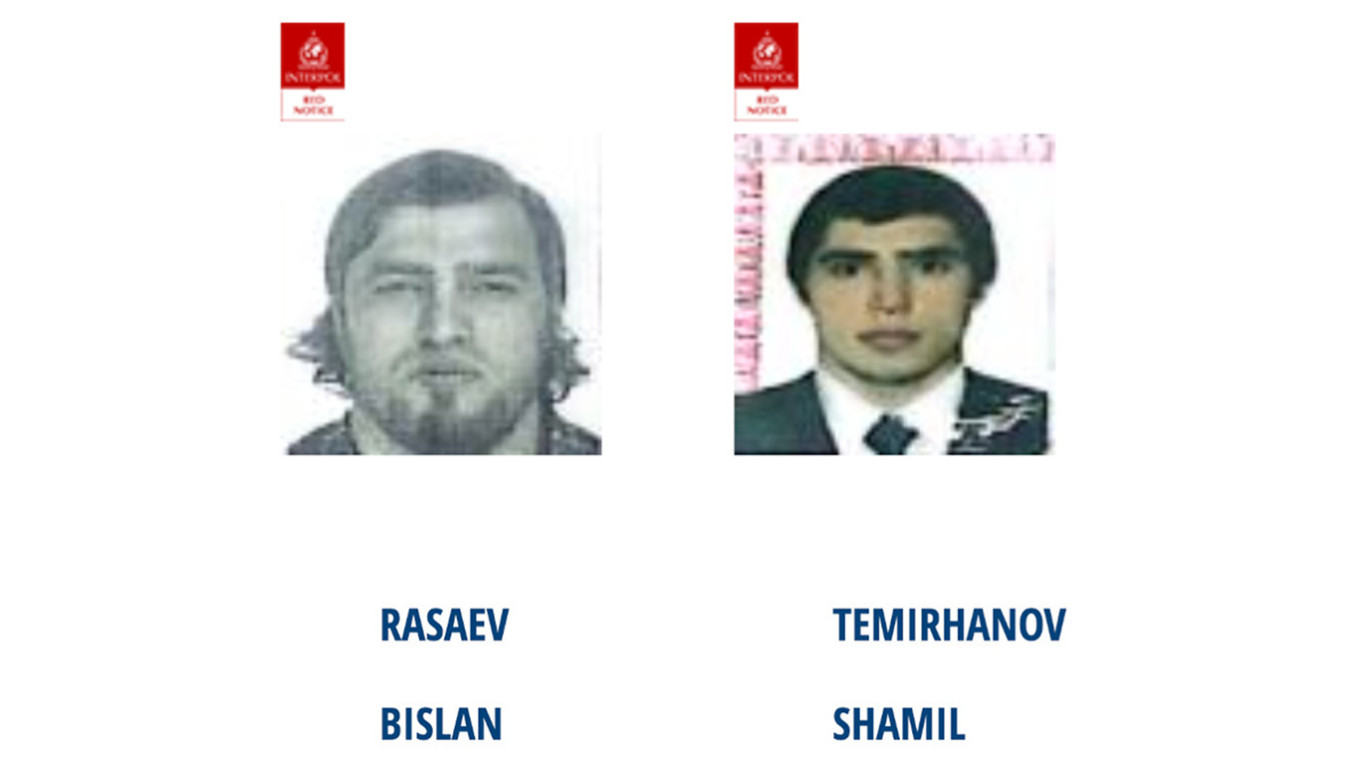 
					The two suspects on Interpol's wanted list.					 					INTERPOL				