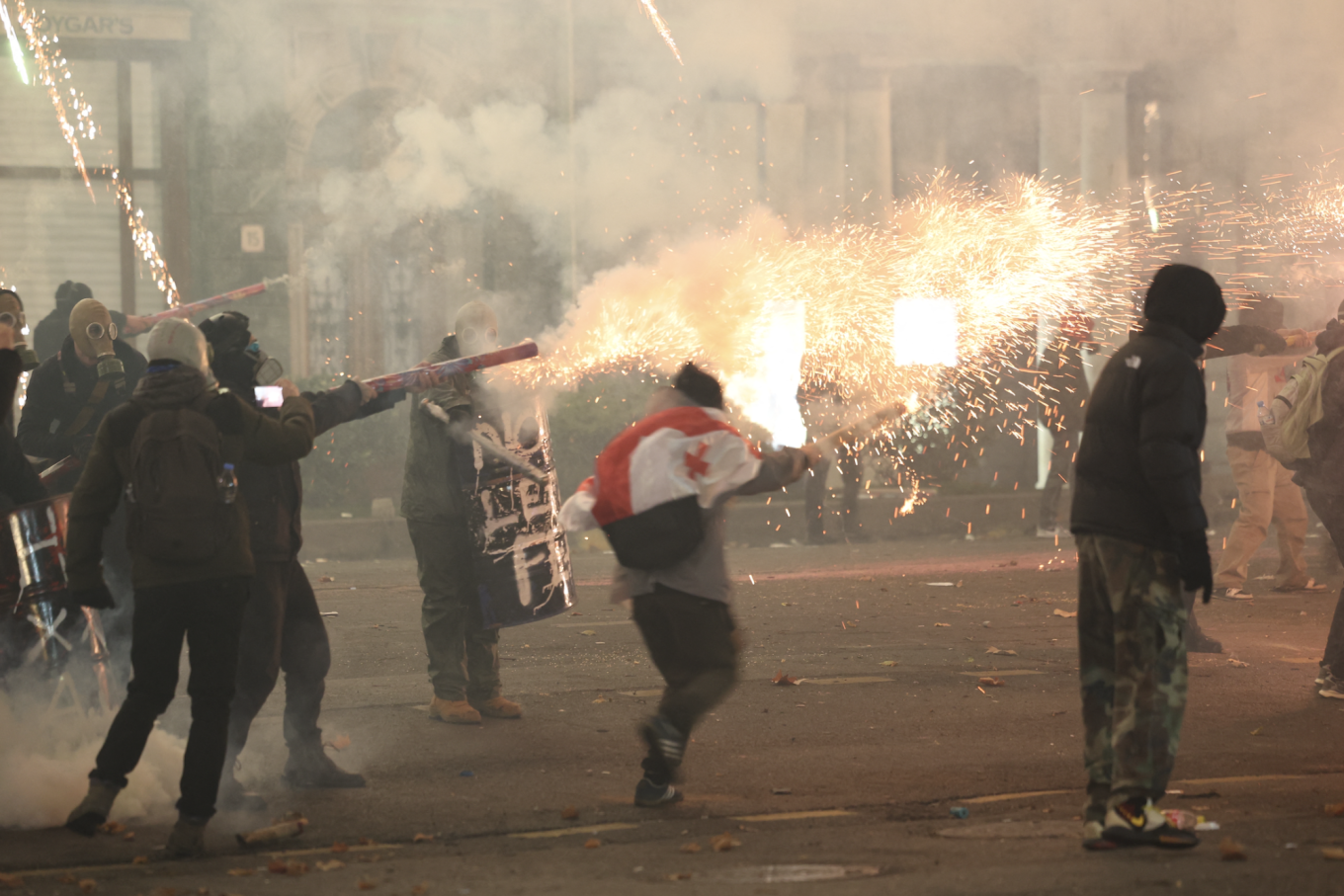 
					Protesters set off fireworks as they clash with police					 					Giorgi ARJEVANIDZE / AFP				