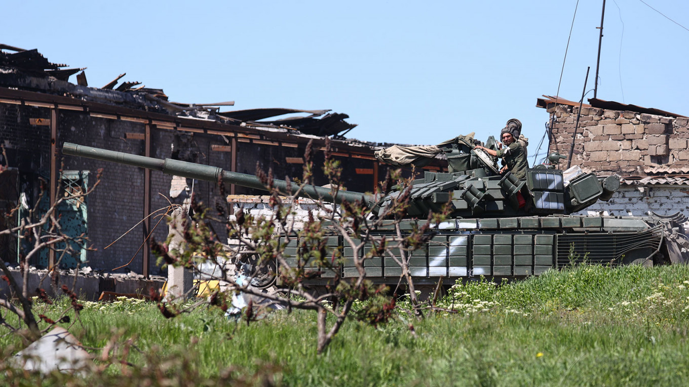 
					A tank belonging to Russian forces is seen in the port city of Mariupol. 					 					Peter Kovalev / TASS				