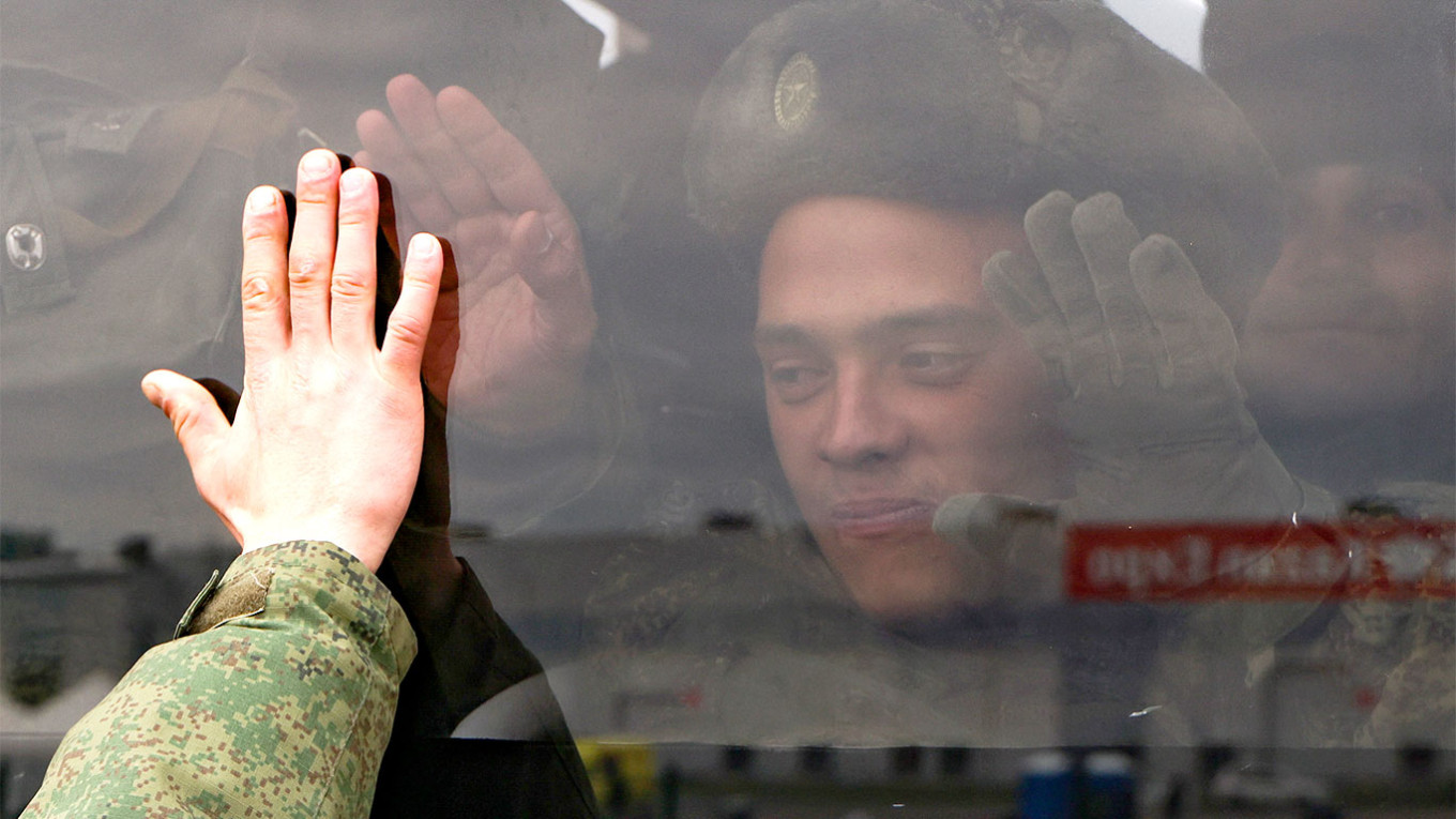 
					A mobilized Russian citizen is seen on a bus.					 					Yegor Aleyev / TASS				