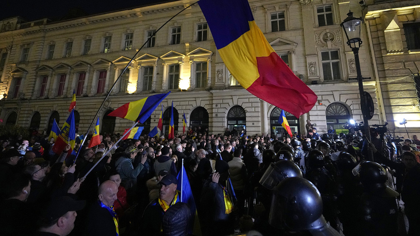 
					Georgescu supporters protest after Romania's electoral body rejected his candidacy in the presidential election rerun in Bucharest.					 					Andreea Alexandru / AP / TASS				