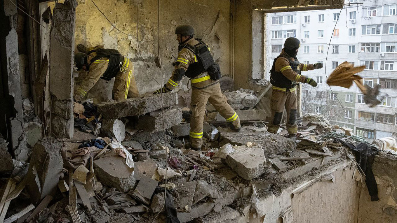 
					Ukrainian rescuers cleaning rubble of a in a residential building following a drone attack in Sumy.					 					State Emergency Service of Ukraine				