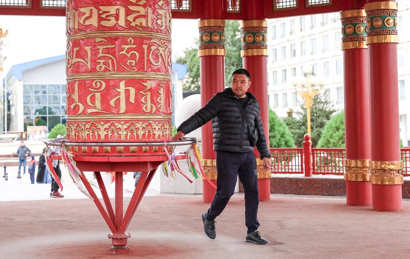 
					A man at a prayer wheel at the Pagoda of Seven Days in Elista, Kalmykia.					 					Erik Romanenko / TASS				