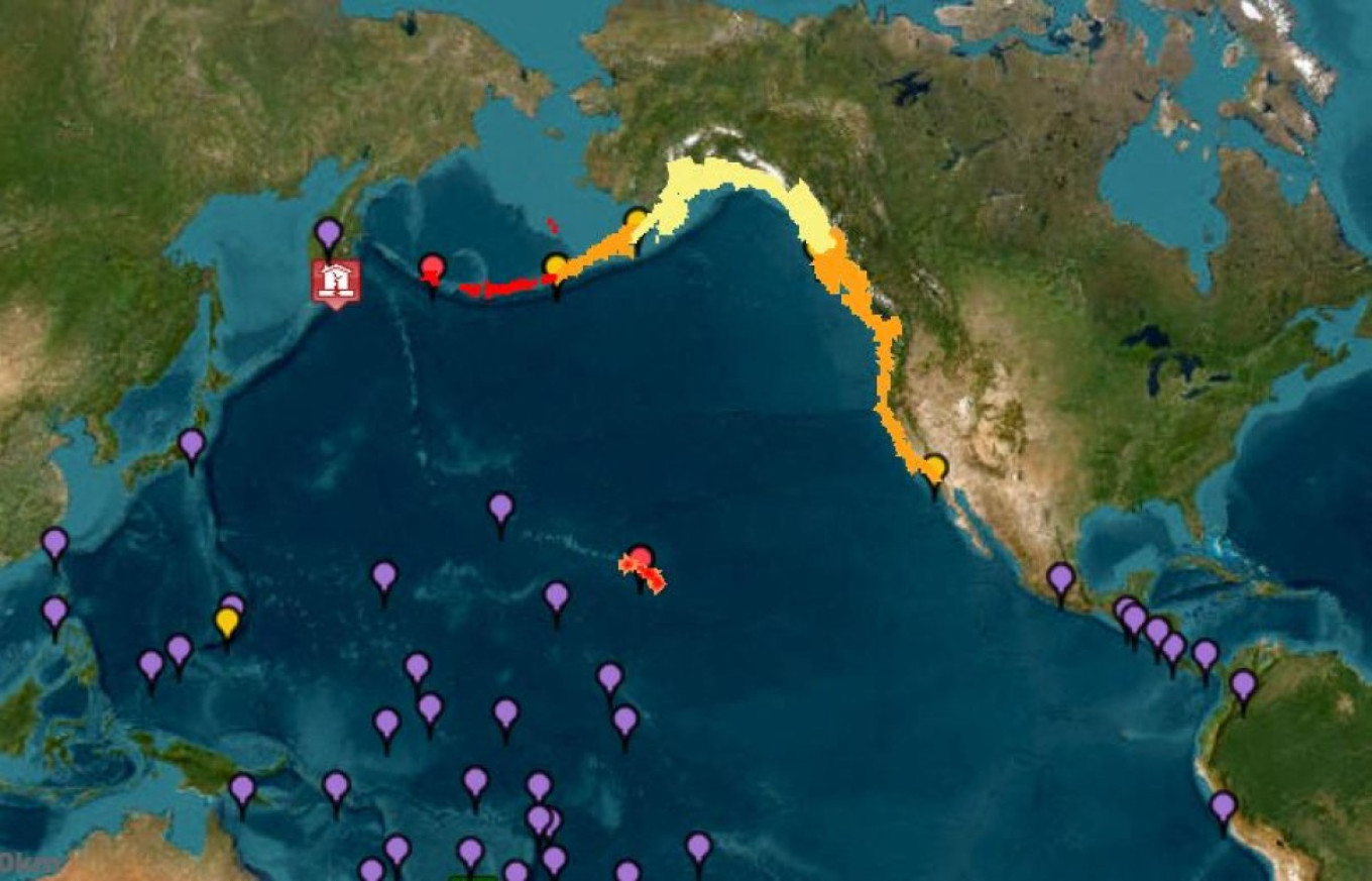 Tsunami warnings (red), advisories (orange) watches (yellow) and threats (purple) after the magnitude 8.8 earthquake. NOAA / AFP