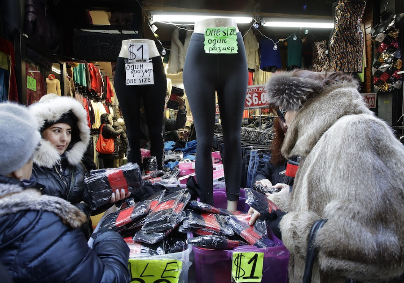 
					Women shop in Brighton Beach, a heavily Russian enclave of New York with over 35,000 residents.					 					Mark Lennihan / AP				