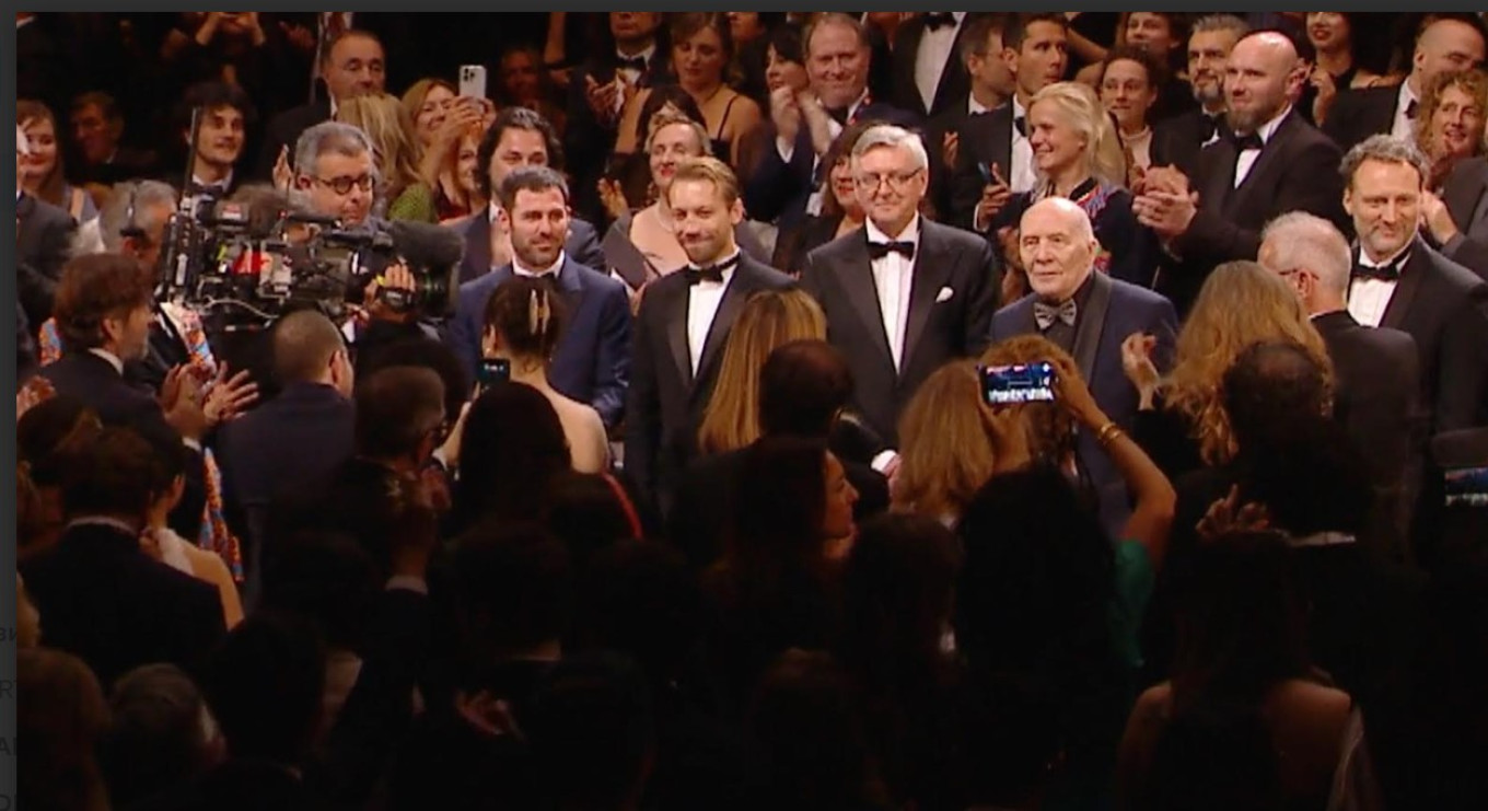Cast and crew at Cannes, Sergei Loznitsa in center in glasses. Courtesy of Cannes Film Festival