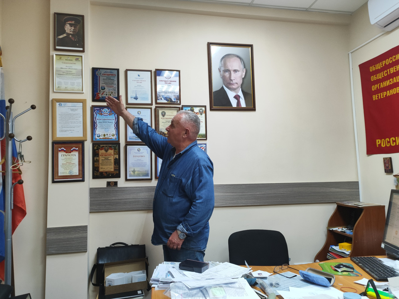 
					Retired navy captain Mikhail Anokhin at his office in Sevastopol.					 					MT				