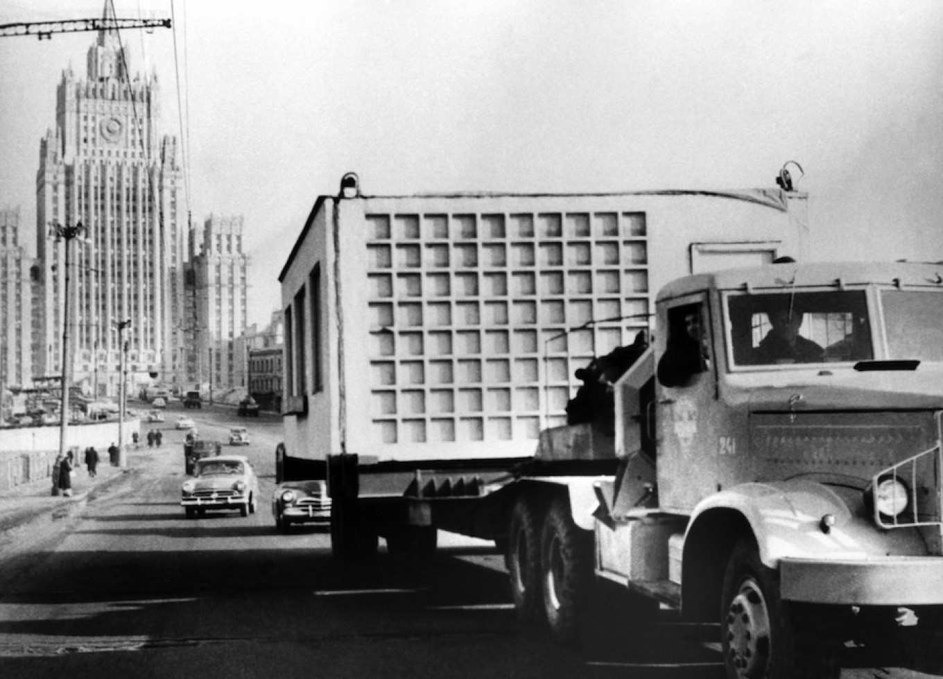 
					A truck transports parts of a Khrushchevka during a massive housing building boom in 1960, Moscow, Soviet Union.					 					TASS				