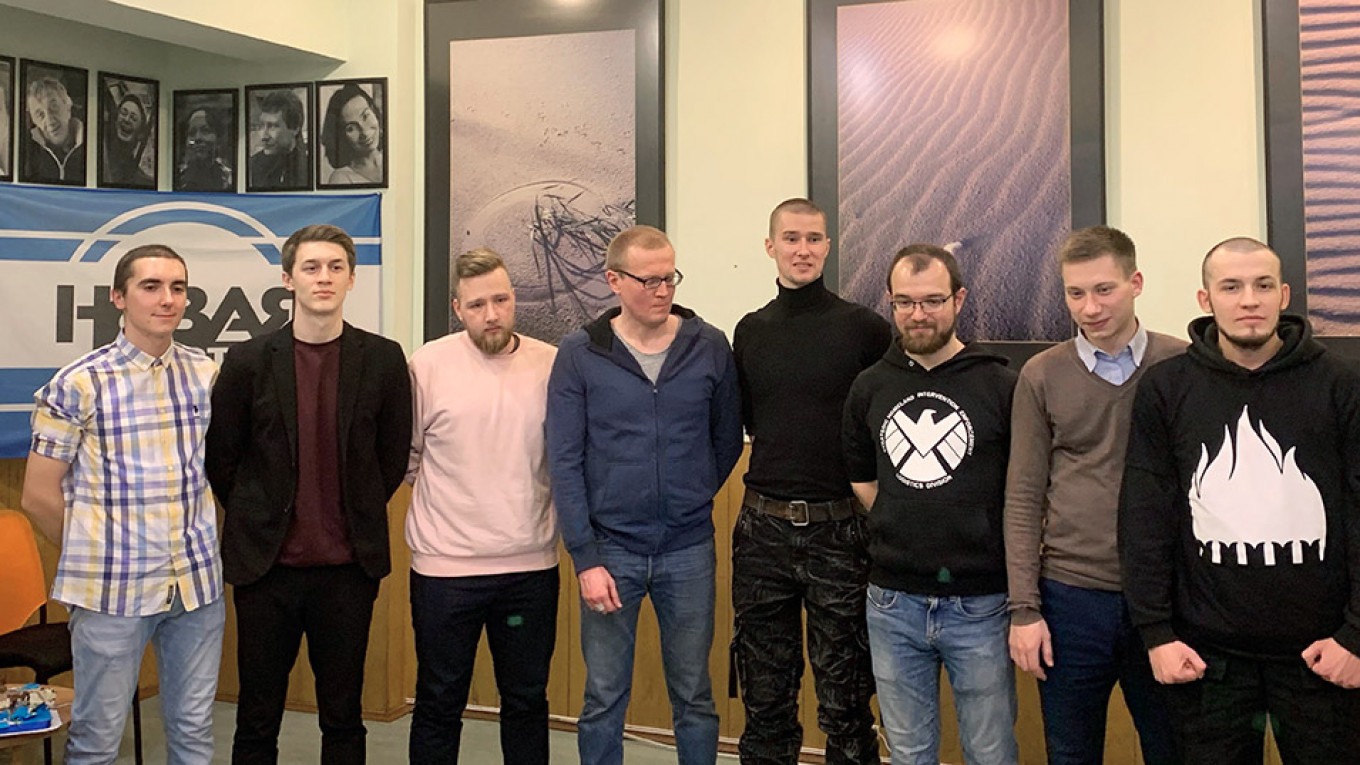 
					Zhukov with fellow former prisoners at a Novaya Gazeta event in his honor on Wednesday. 					 					Evan Gershkovich / MT				