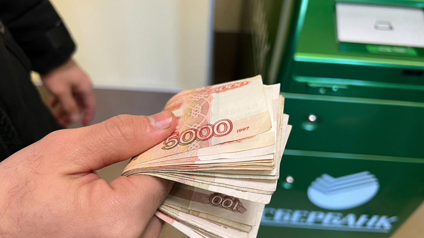 
					A wad of 5,000 ruble banknotes.					 					Moskva News Agency				