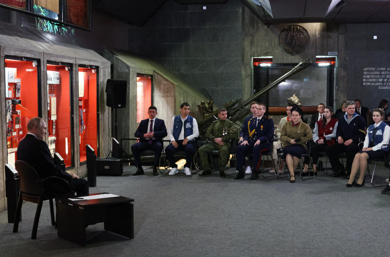 
					Putin (L) meets with representatives of patriotic and youth organizations at the Battle of Stalingrad Panorama Museum, February 2023.					 					Mikhail Klimentyev / Russian Presidential Press and Information Office / TASS				