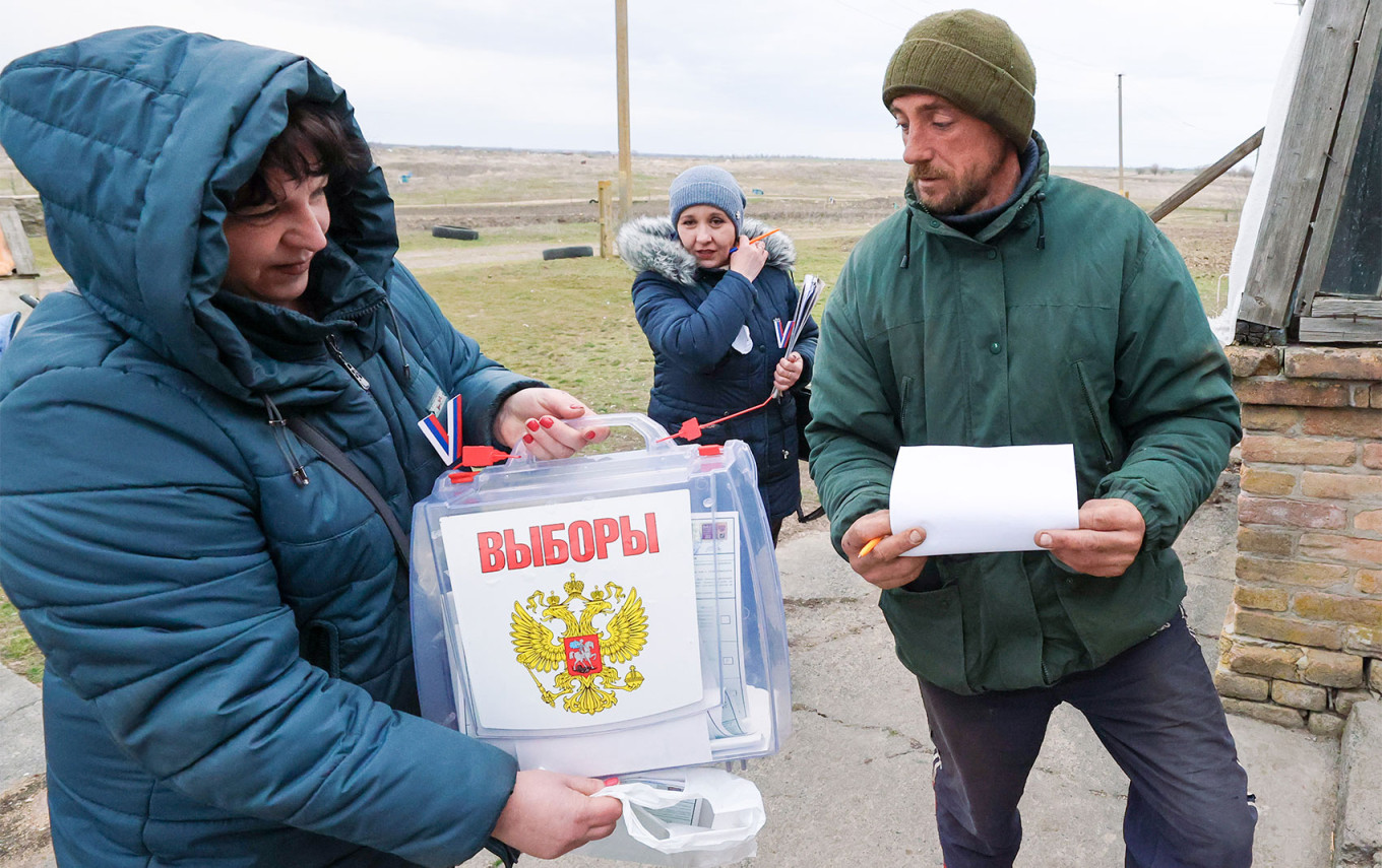 
					Voting in the Zaporizhzhia region in the Russian presidential election.					 					 Alexander Polegenko /TASS				