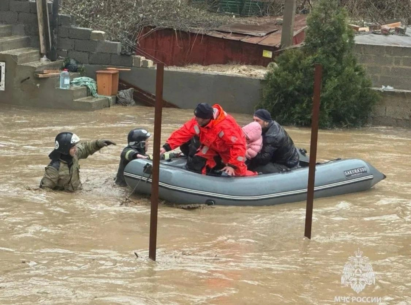 
					Emergency workers evacuate people during flooding in Dagestan.					 					Russian Emergency Situations Ministry				