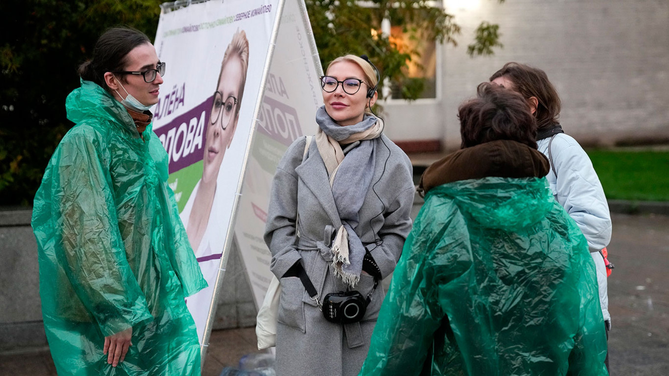 
					Women's rights activist and State Duma candidate Alyona Popova campaigning in Moscow, Sept. 3, 2021.					 					Pavel Golovkin / AP / TASS				