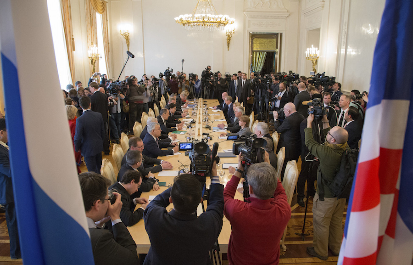 Media surround a table as U.S. Secretary of State Rex Tillerson and Russian Foreign Minister Sergei Lavrov talk in Moscow, Russia, April 12, 2017. Ivan Sekretarev / AP