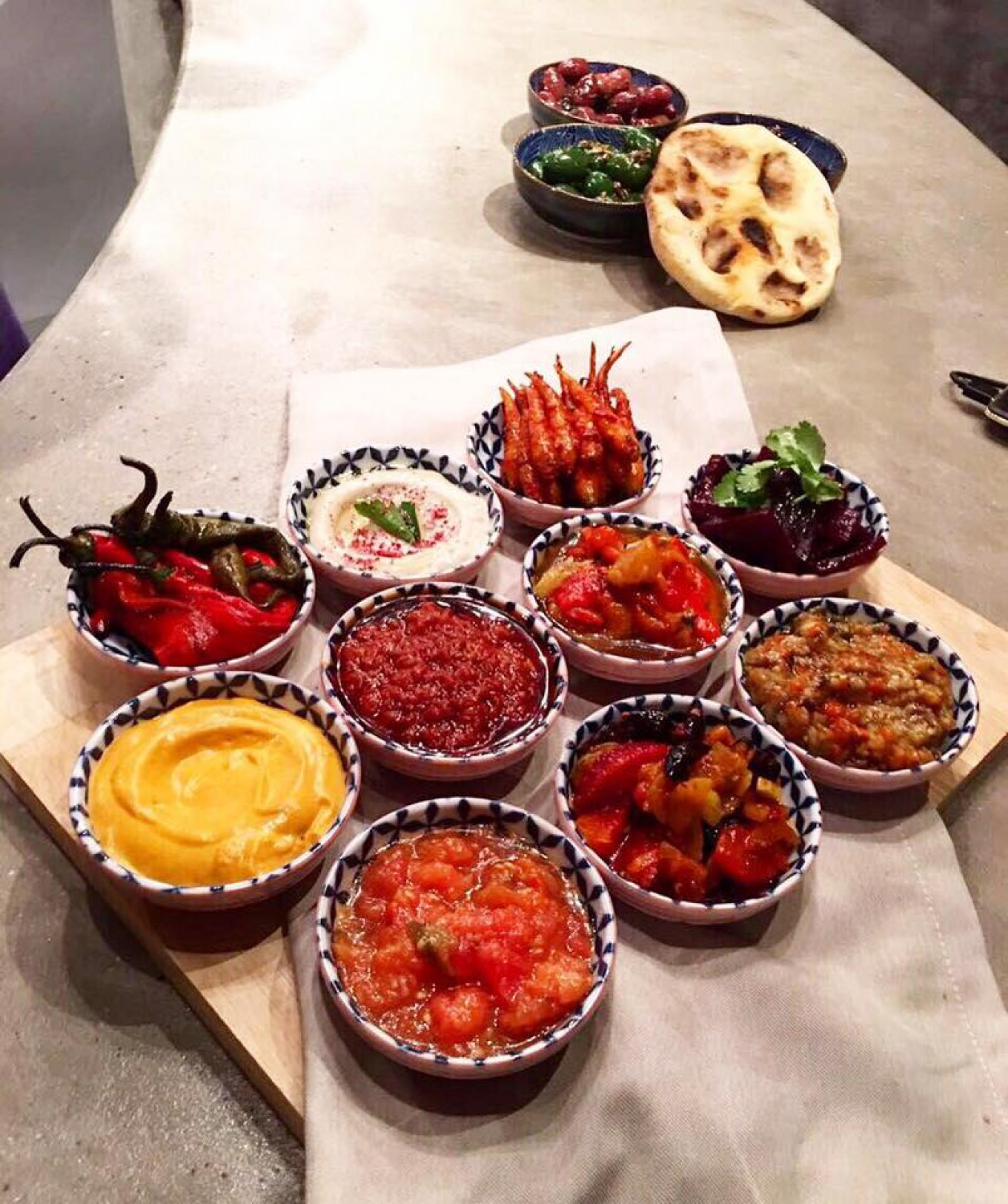 
					The appetizers at Nofar come in the form of small dishes of Middle Eastern-style meze.					 					Nofar				