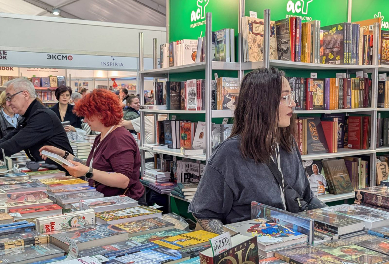 
					Browsing books at the St. Petersburg International Book Fair.					 					Moscow Times Reporter				