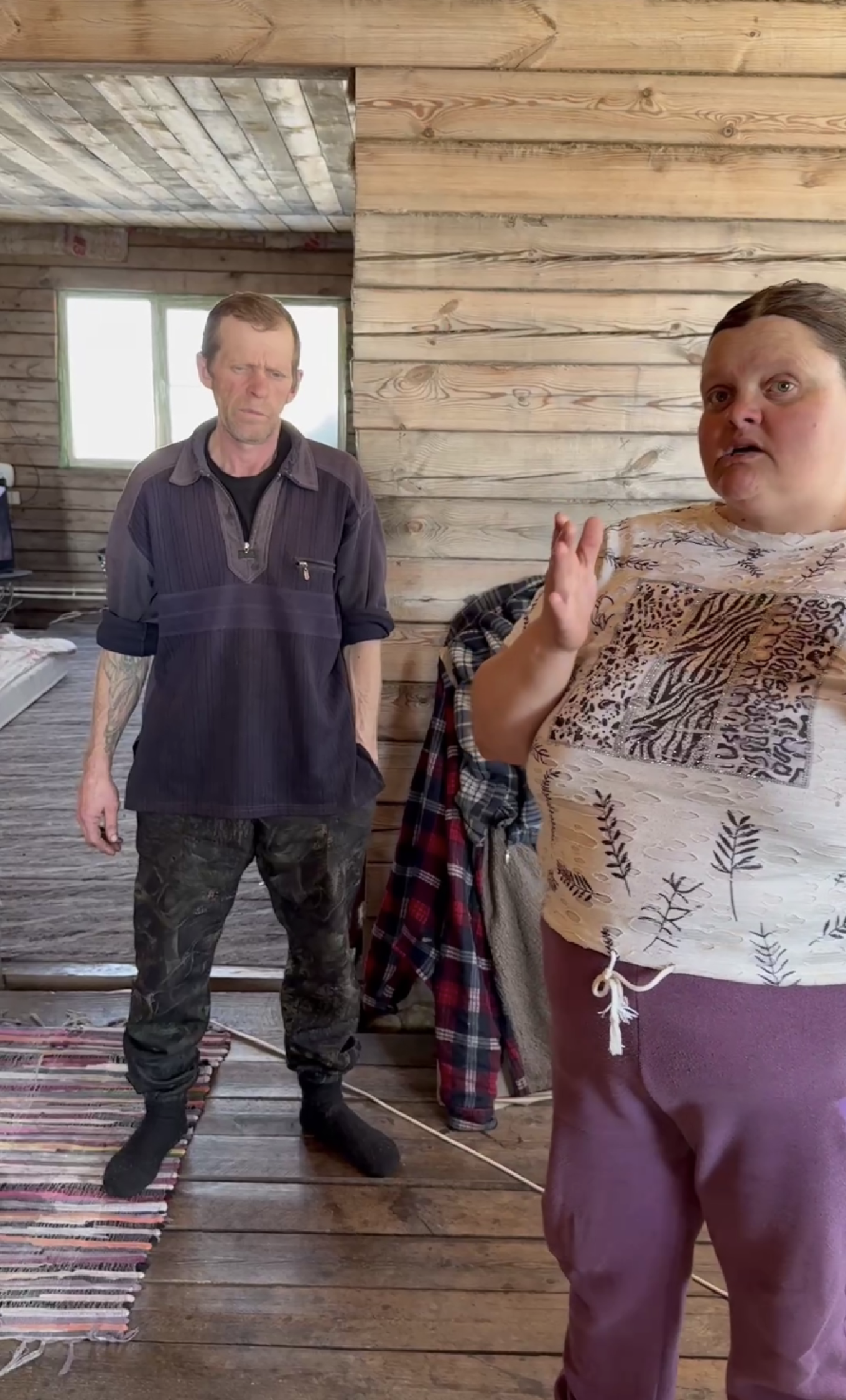 
					Marina (right) and her husband, who run a small farm in the village of Kozikha, give a tour of their home.					 					dariagriamironenko / Telegram				