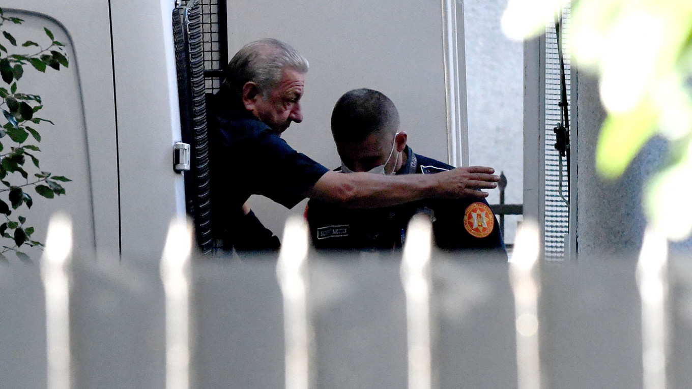 
					Telman Ismailov (L) during his escort to a court in Podgorica.					 					Savo Prelevic / AFP				