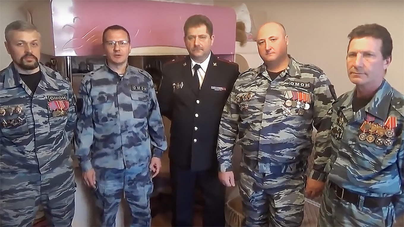 Russian Riot Police Complain of Evictions in Video to