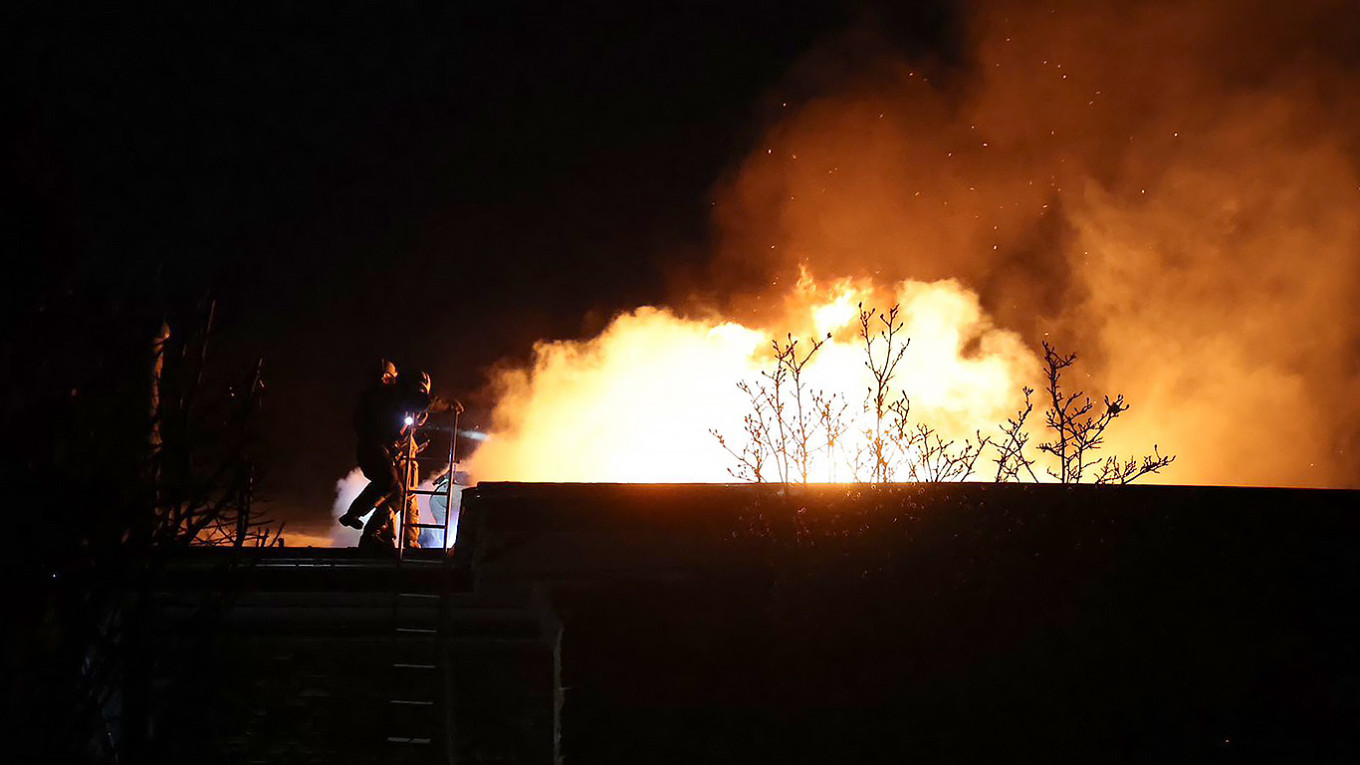 
					Ukrainian firefighters working at the scene of an air attack in Dnipro, Ukraine, Nov. 21, 2024.					 					State Emergency Service of Ukraine				