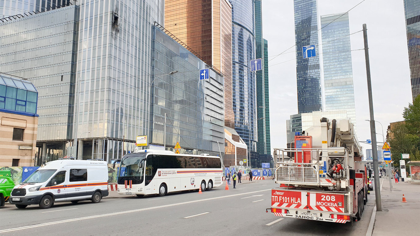 Emergency services at the Moscow City tower, which was hit by a drone on Aug. 23. Moskva News Agency