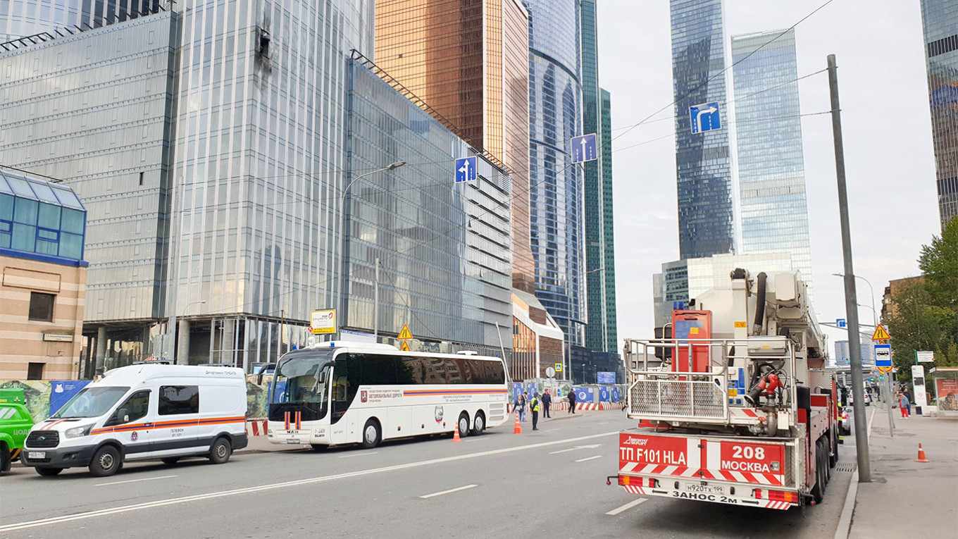 
					Emergency services at the Moscow City tower, which was hit by a drone on Aug. 23.					 					Moskva News Agency				