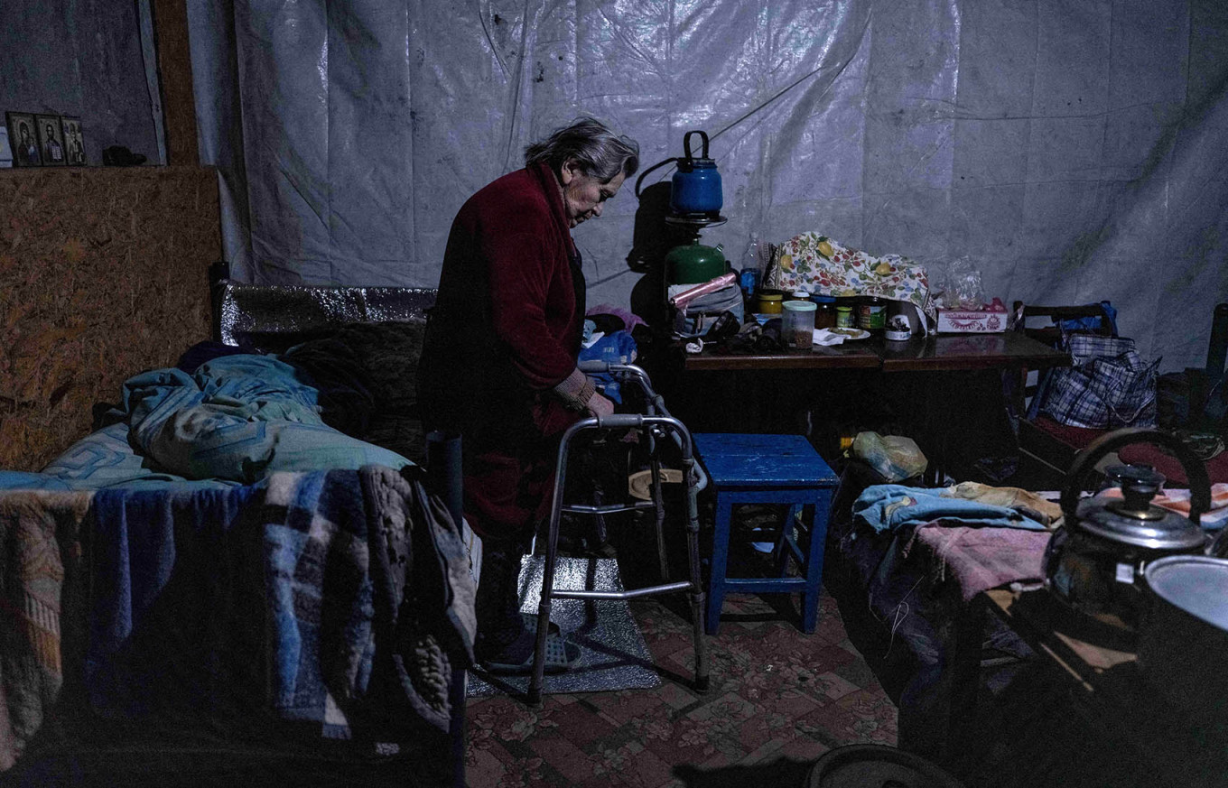 A woman stands in the basement of an apartment block that has become a shelter and place of residence for civilians in Pokrovsk. Iryna Rybakova / The 93rd Separate Mechanized Brigade of the Ukrainian Ground Forces / AFP
