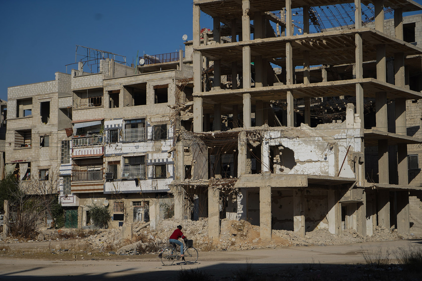 
					A boy riding a bike in Eastern Ghouta after the liberation by HTS in December 2024. In addition to the massive destruction, its residents suffered from the devastating chemical attacks by the Assad regime. Syria, Jan. 7, 2025.					 					Iryna Matviyishyn				