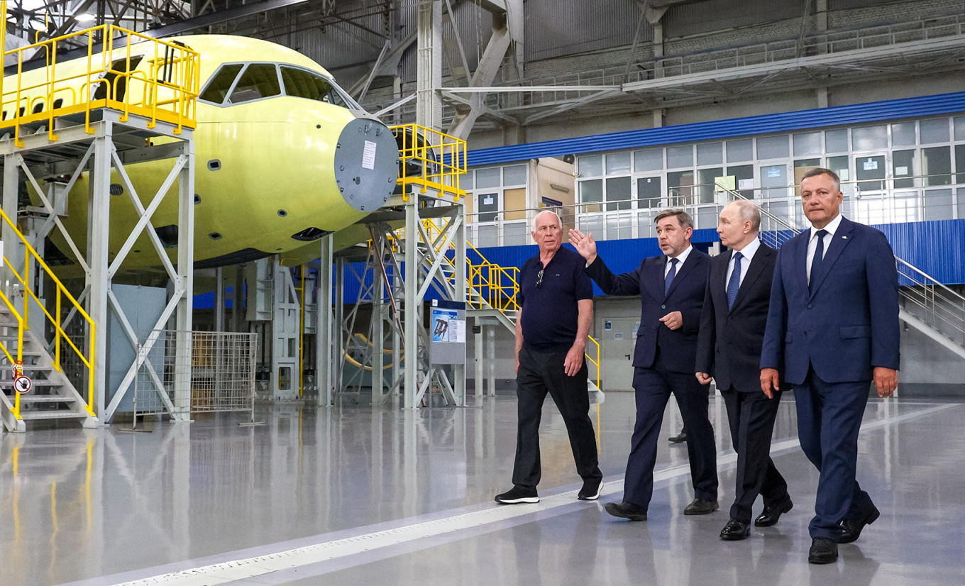 
					President Vladimir Putin visits an aviation plant in Irkutsk.					 					 Sputnik / Vyacheslav Prokofyev / Pool via REUTERS 				