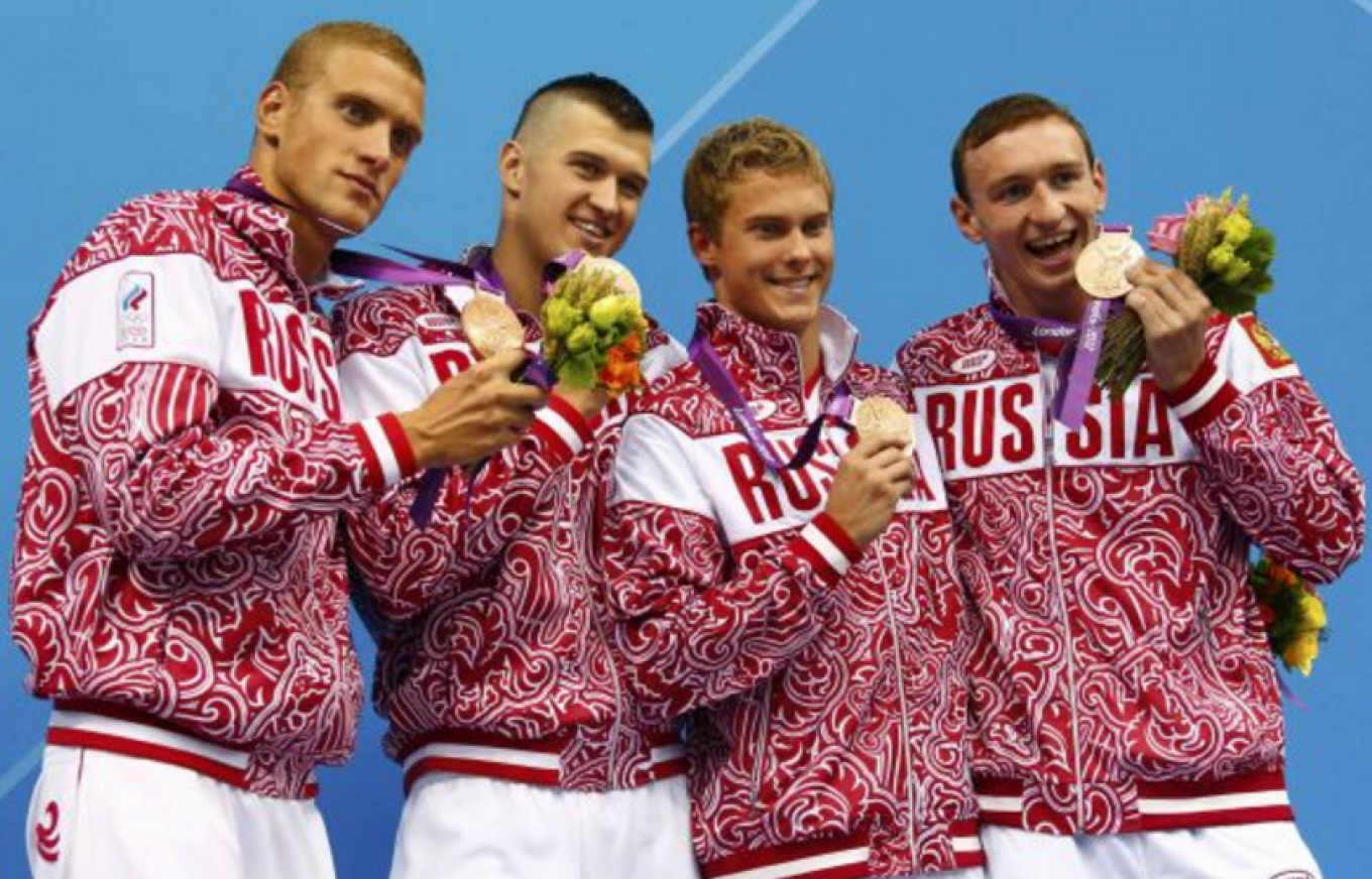 
					Swimmers Andrei Grechin, Nikita Lobintsev, Vladimir Morozov and Danila Izotov posing in Bosco uniforms with their bronze medals Sunday in London.					 					David Gray				